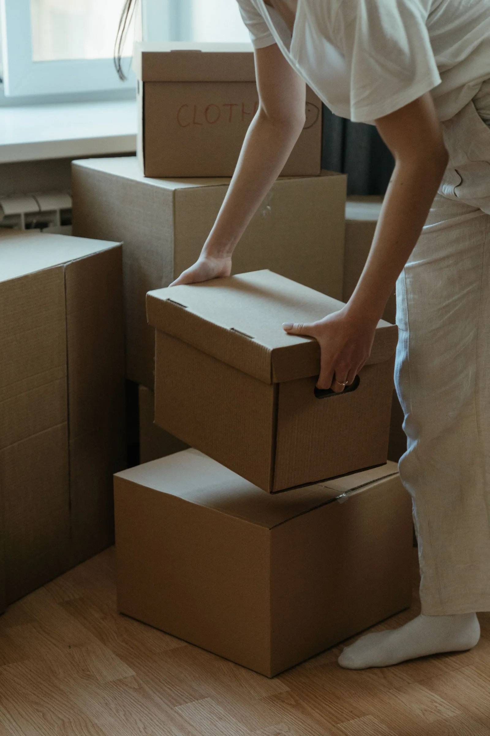 Belongings carefully grouped and boxed during a downsizing move.